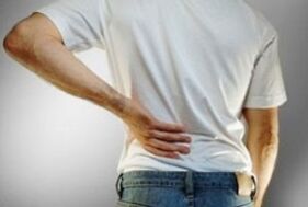 pain in the lower back due to osteochondrosis